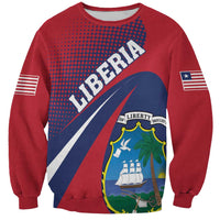 Red crewneck sweatshirt with 'LIBERIA' print and crest graphic on front