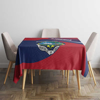 Rectangular Liberia flag tablecloth on dining table, red and navy with central crest badge