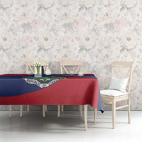 Red and navy Liberia crest tablecloth laid on a dining table with matching drape edges