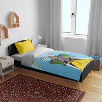 Light blue duvet cover with coat-of-arms crest and editable text, paired with yellow pillow