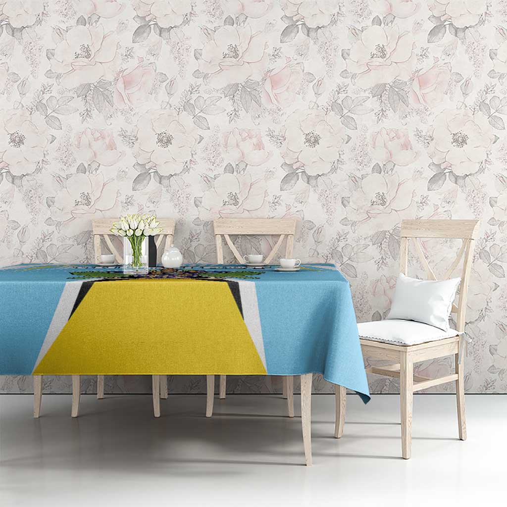 Blue tablecloth featuring centered crest design on dining set.