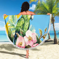 Saint Lucia beach blanket with green parrot and pink flowers, white fringed edge, held up