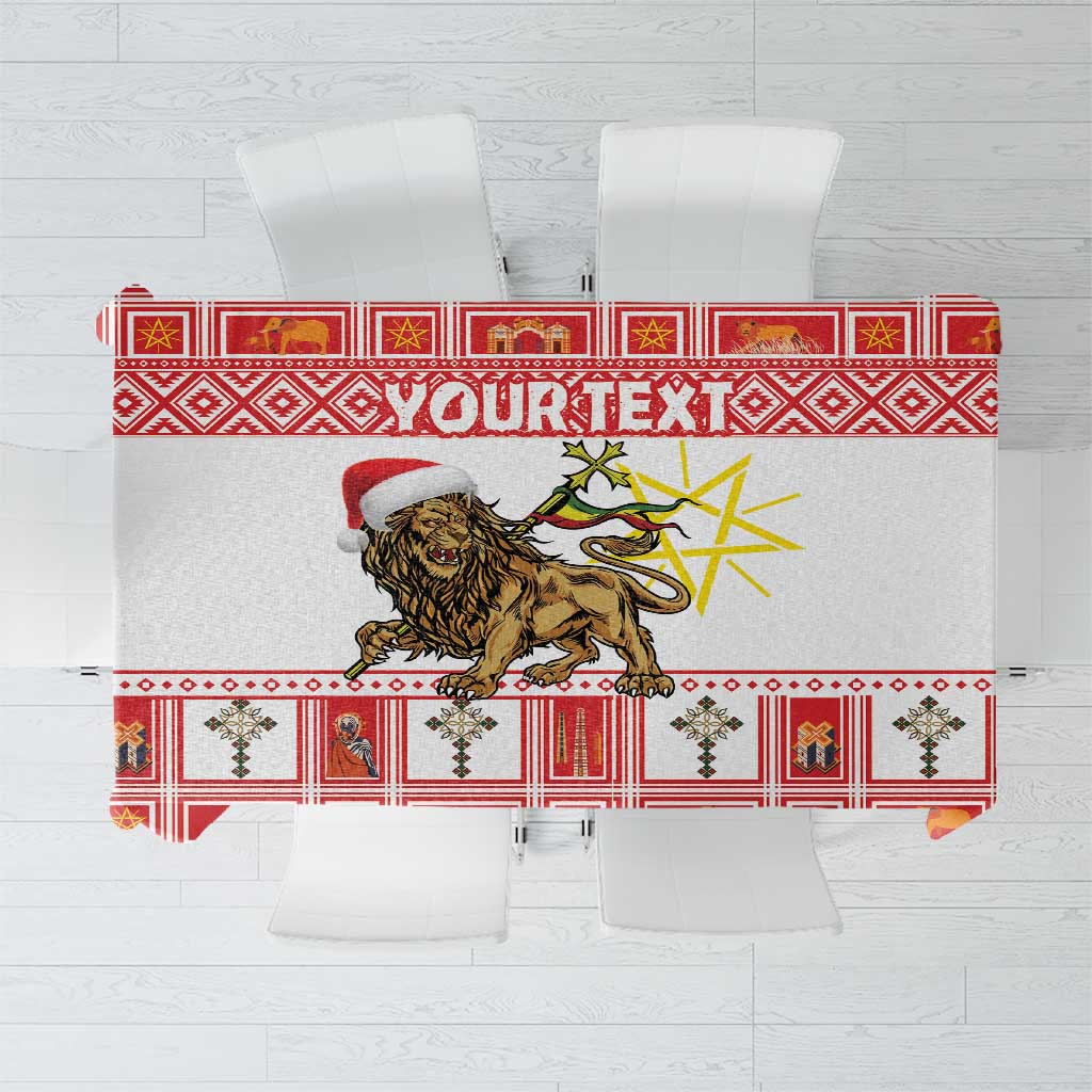 Red patterned tablecloth with gold-and-black lion design and ornate border