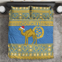 Blue duvet bedding set with gold camel, laurel, and checker-style emblem striping