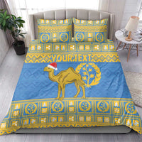 Blue and gold patterned bedding set with camel and geometric border; matching pillowcases