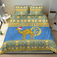 Blue bedding set with gold borders, camel with Santa hat, and two square pillow shams