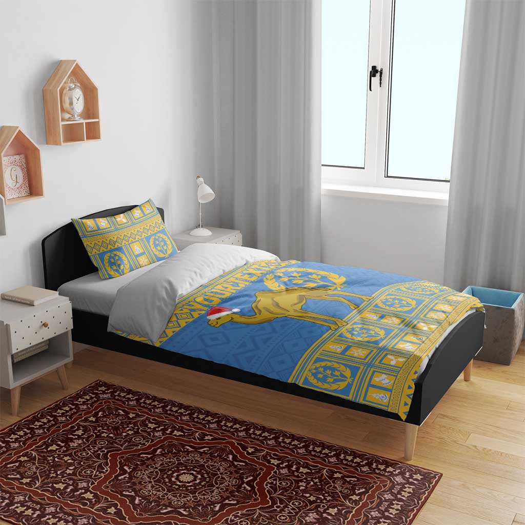 Blue bedding set with gold camel and laurel motif on duvet, plus matching pillow sham