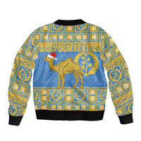 Blue bomber jacket with gold geometric print, camel and laurel on back, ribbed cuffs