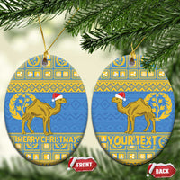 Blue oval Eritrea Christmas ceramic ornament with gold camel; one shows “YOURTEXT”