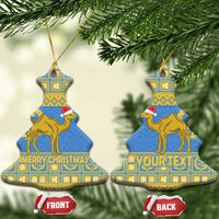 Blue tree-shaped Eritrea Christmas ceramic ornament with gold camel and “MERRY CHRISTMAS”