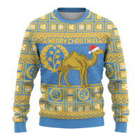 Light blue ugly Christmas sweater with gold patterns, camel, and 'MERRY CHRISTMAS' text