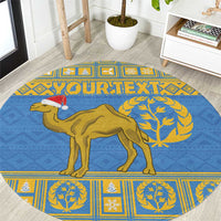 Blue round rug with gold camel and decorative border pattern