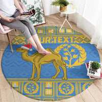 Blue round rug with gold camel, tree motif, and patterned border
