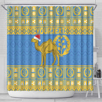 Blue shower curtain with gold squares and camel emblem in middle, 'YOUR TEXT' on banner.