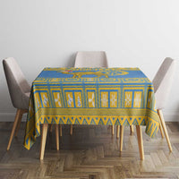 Blue tablecloth with yellow border and ornate national emblem pattern for table