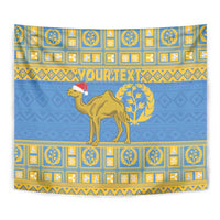 Blue tapestry close-up with camel wearing red hat and gold laurel wreath