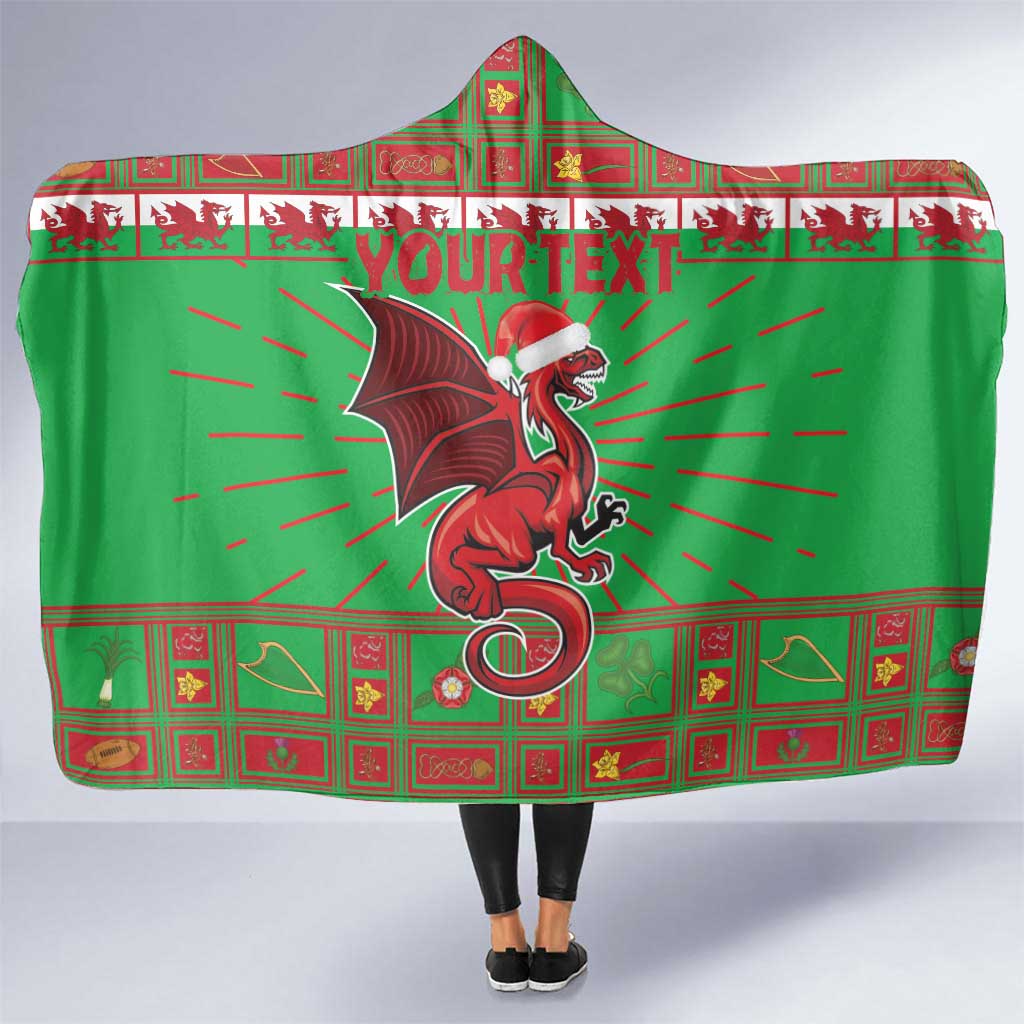 Green hooded blanket with Welsh dragon crest and colorful red plaid border