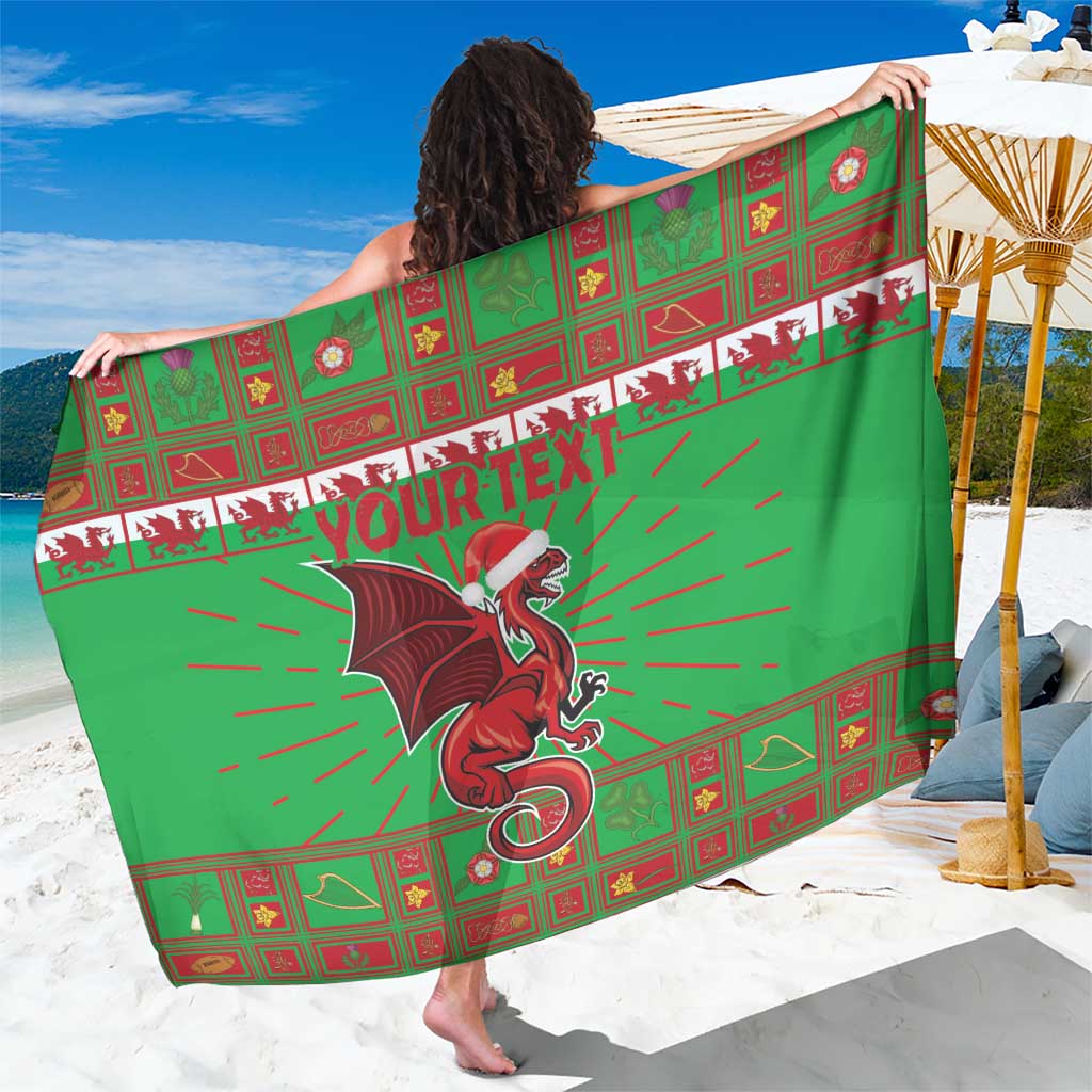 Green sarong with red Welsh grid pattern, dragon mascot, and 'YOUR TEXT' center text