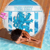 Round blue beach blanket with fringe edge, dragon graphic and 'YOUR TEXT' on mat