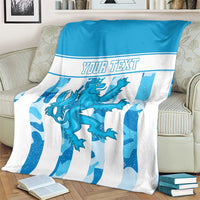 Personalized Luxembourg blanket on armchair, blue and white striped crest with “YOUR TEXT”