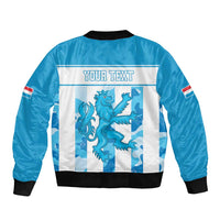 Blue bomber jacket back with 'YOUR TEXT' print, dragon graphic, black ribbed hem and cuffs