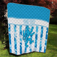 Blue top quilt with white striped section, dragon crest center, and personalized text