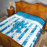 Quilt on bed with blue top border, white and blue stripes, dragon graphic, custom text
