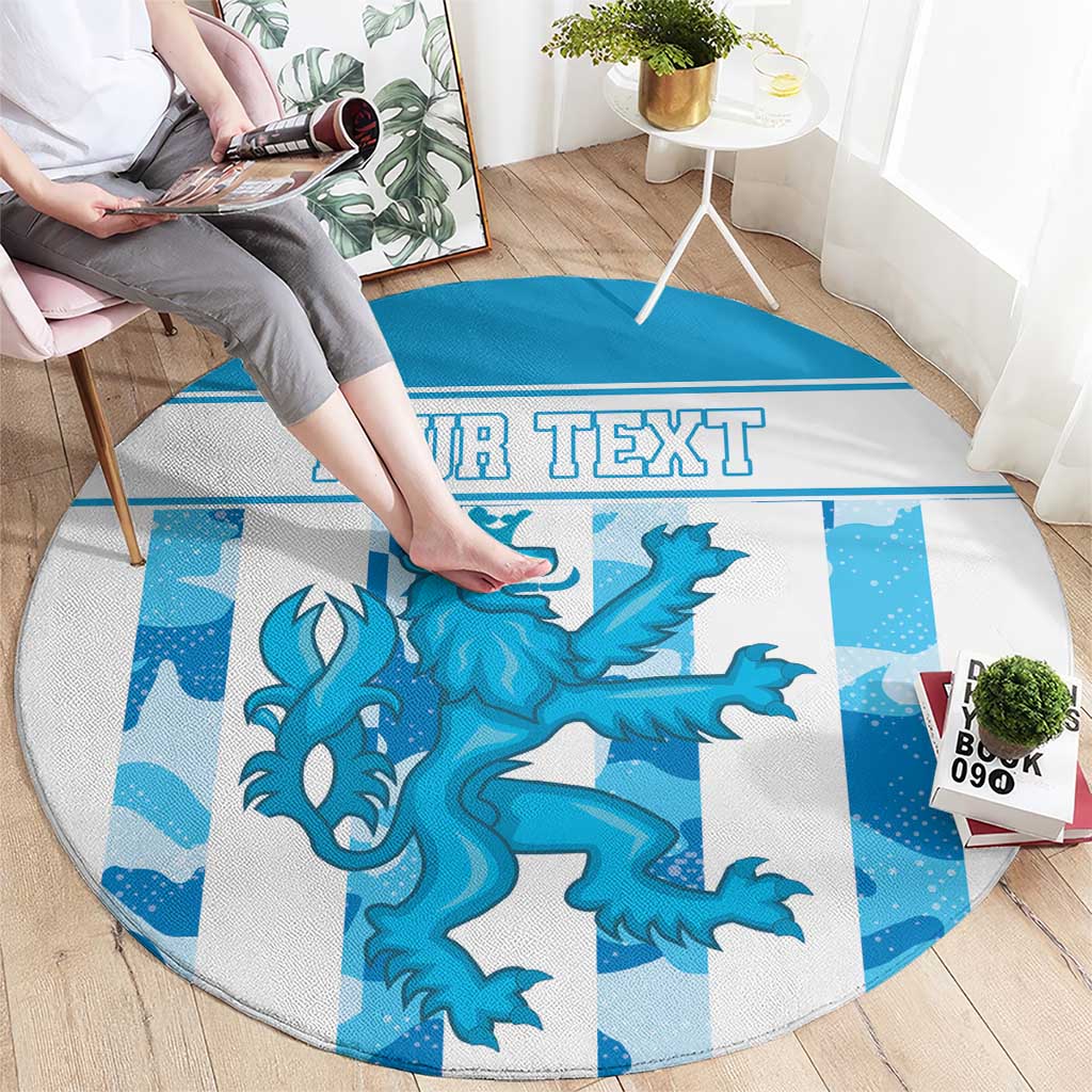 Round blue circular rug featuring a teal dragon graphic and 'YOUR TEXT' strip