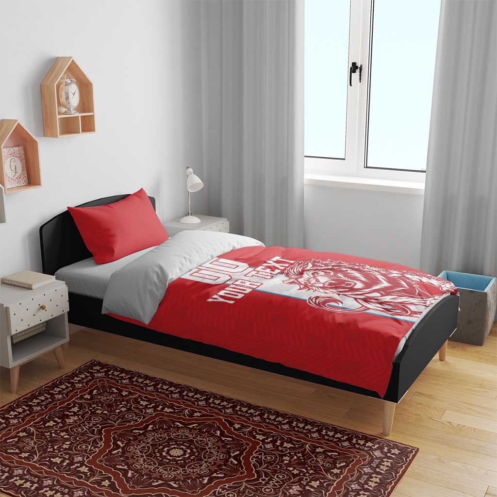 Red football bedding set with duvet and two pillows, lion mascot design on bed