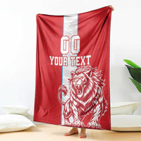 Red blanket draped with white stripe, bold YOUR TEXT and roaring lion graphic