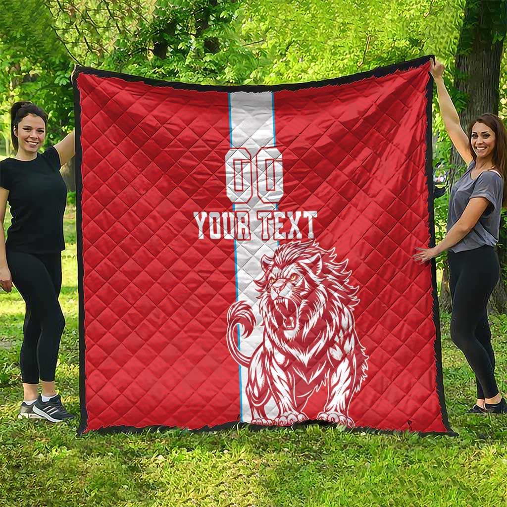Red quilt with white center stripe, lion graphic, 'YOUR TEXT' and number 00, outdoors