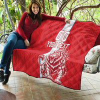 Red quilt on patio with white stripe, lion graphic, 'YOUR TEXT' and 00