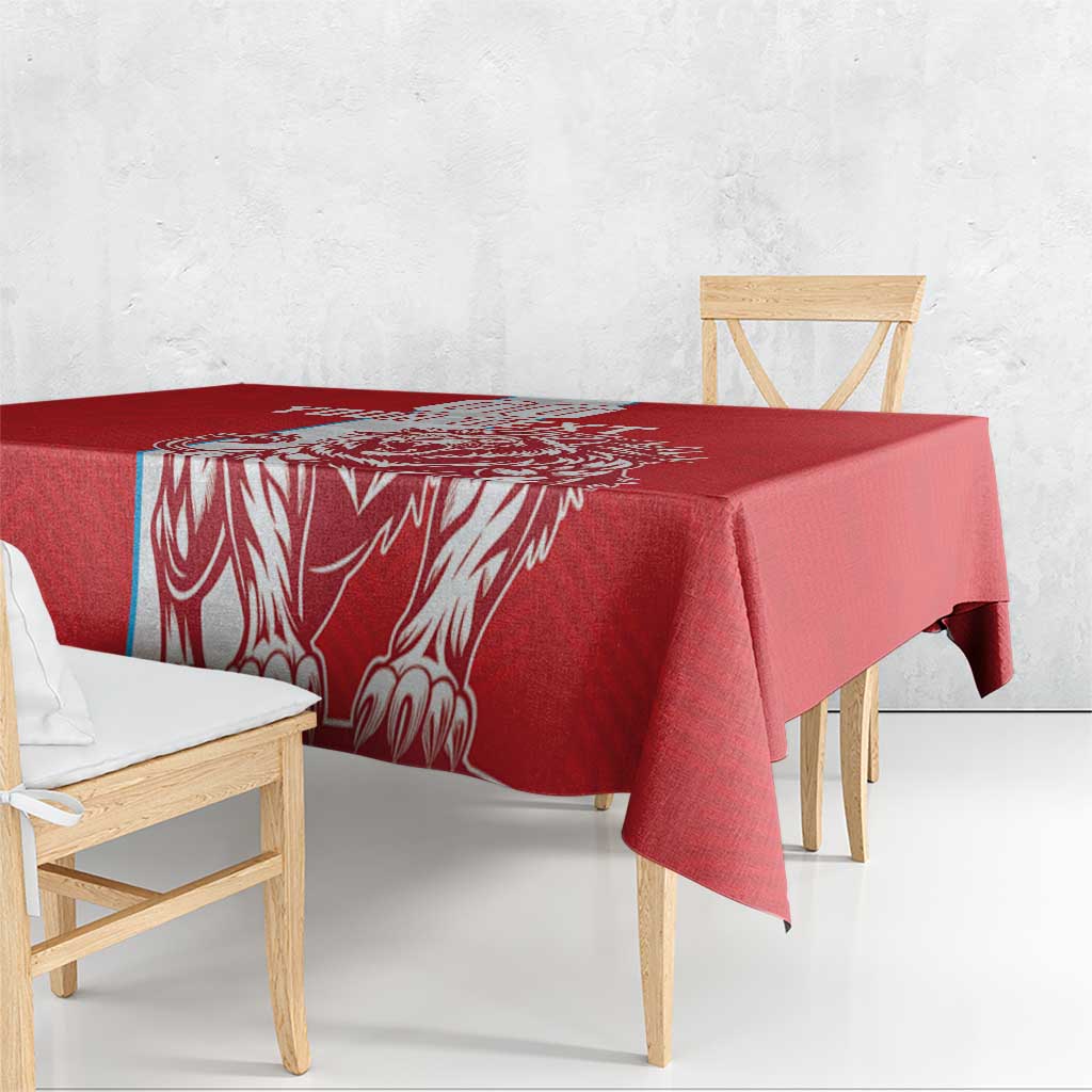Red football tablecloth with white lion-style graphic panel and side drape