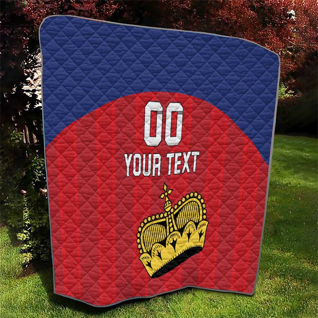 Custom football quilt outdoors, blue top and red center with crown graphic, '00' and 'YOUR TEXT'.