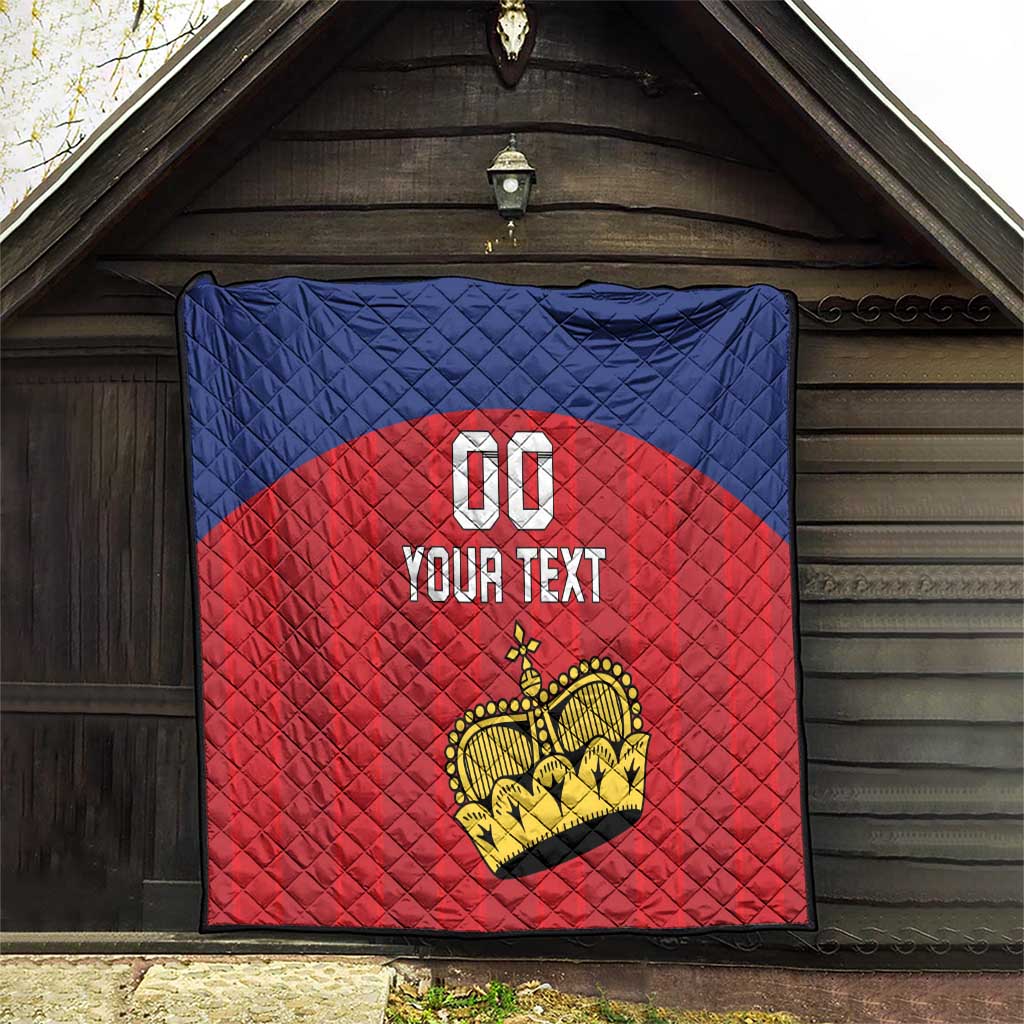 Custom football quilt hanging in an entryway, blue and red diamond stitching with crown and 'YOUR TEXT'.