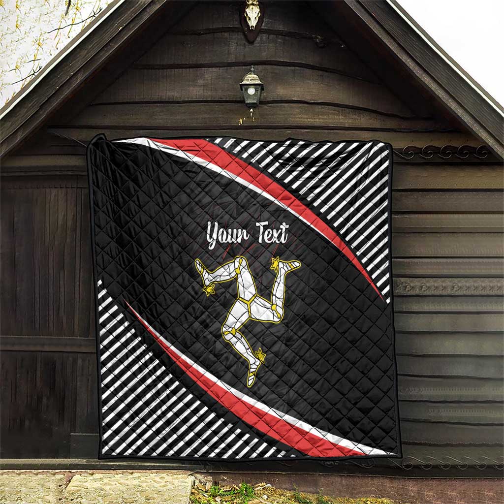 Personalized black quilt hanging outdoors with red diagonal stripe, striped border, rider emblem