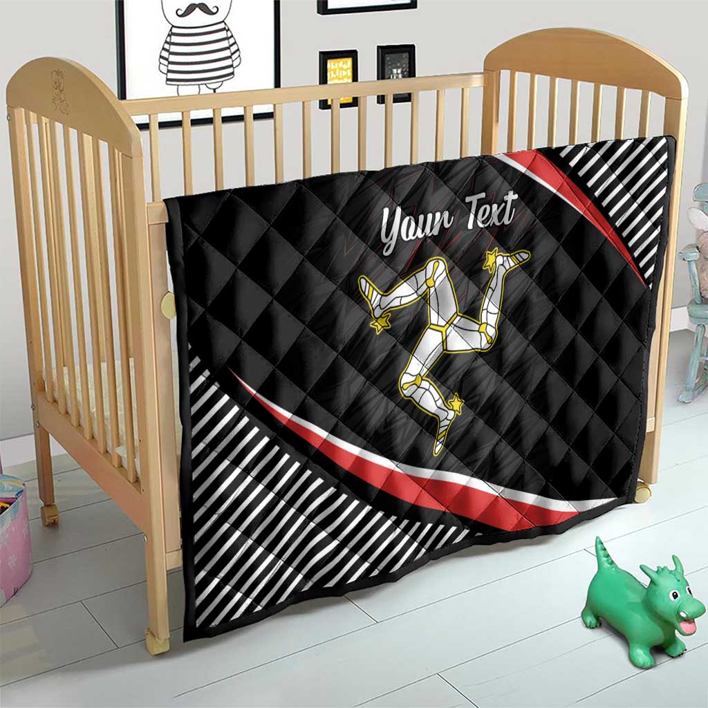 Personalized black quilt on crib with red diagonal stripe, striped border, rider emblem