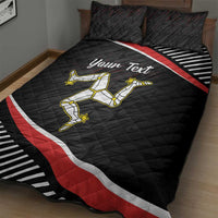Black quilt bed set with two pillows, red-and-white diagonal bands, yellow runner graphic