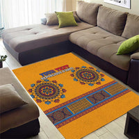 Yellow area rug with blue ornamental bands, medallion motifs, and personalized text