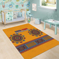 Yellow area rug with blue dashiki medallions and personalized Haiti text