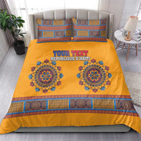 Yellow dashiki bedding set with blue medallions, geometric border, and two matching pillows