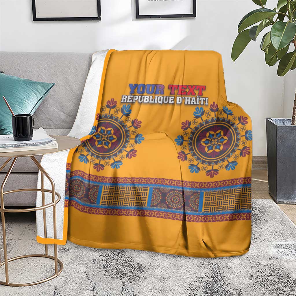 Yellow dashiki-style blanket draped on couch with blue circular motifs and 'YOUR TEXT'