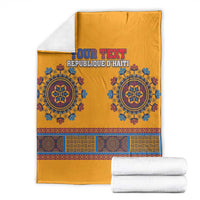 Folded yellow dashiki-style blanket with blue circular motifs and 'YOUR TEXT' headline