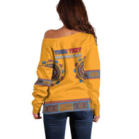 Yellow off-shoulder sweater back with blue personalized text graphic