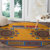 Round yellow dashiki-style carpet with blue-and-orange geometric border and personalized text