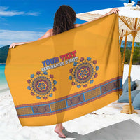 Yellow dashiki-style sarong with blue circular medallion print and 'YOUR TEXT' wording