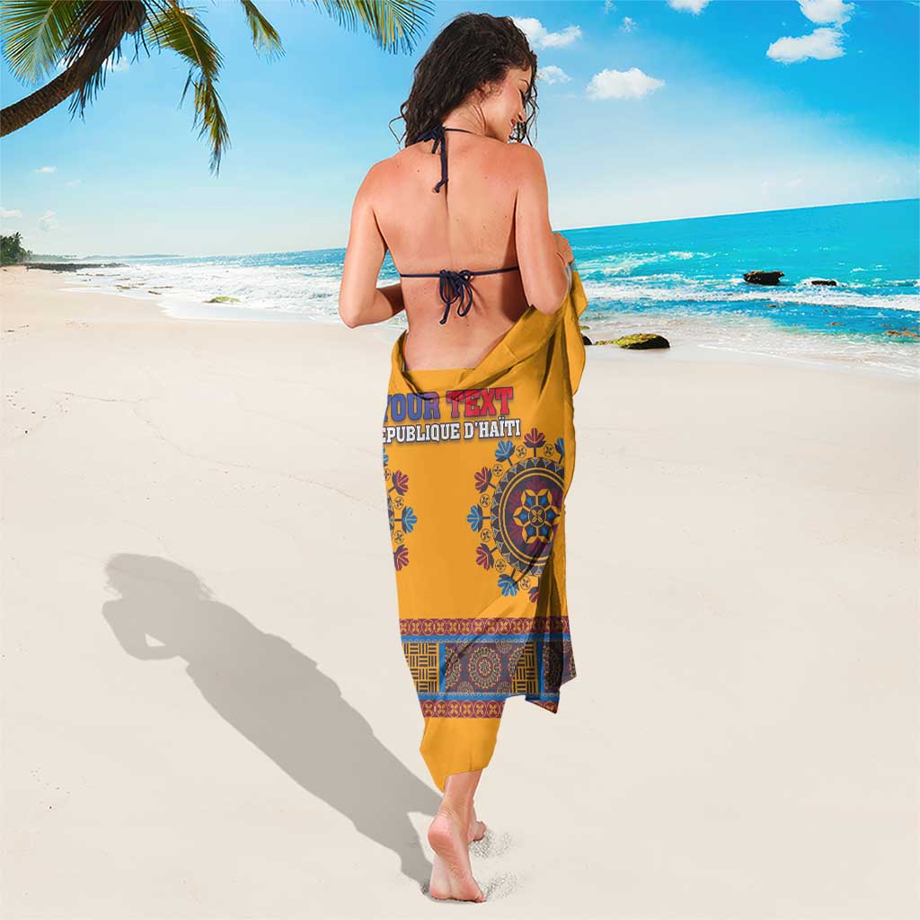 Yellow personalized sarong with blue central emblem and 'YOUR TEXT' band at the back