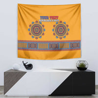 Yellow dashiki tapestry with blue circular symbols and an ornate geometric band