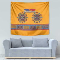 Yellow dashiki tapestry with two blue emblem medallions and a multicolor patterned stripe