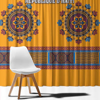 Yellow dashiki curtain close-up with blue emblem and colorful geometric border